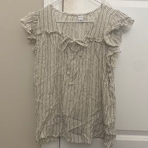 Off white sleeveless blouse with charcoal pattern